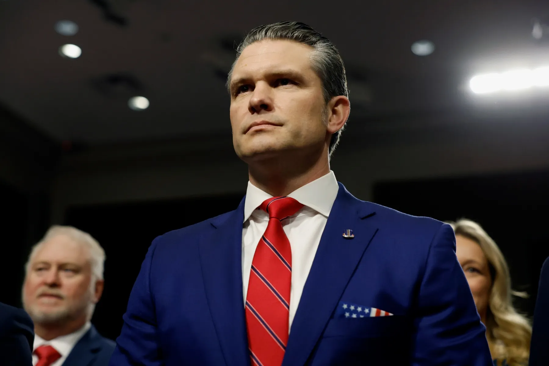 Pete Hegseth stands at his confirmation hearing.