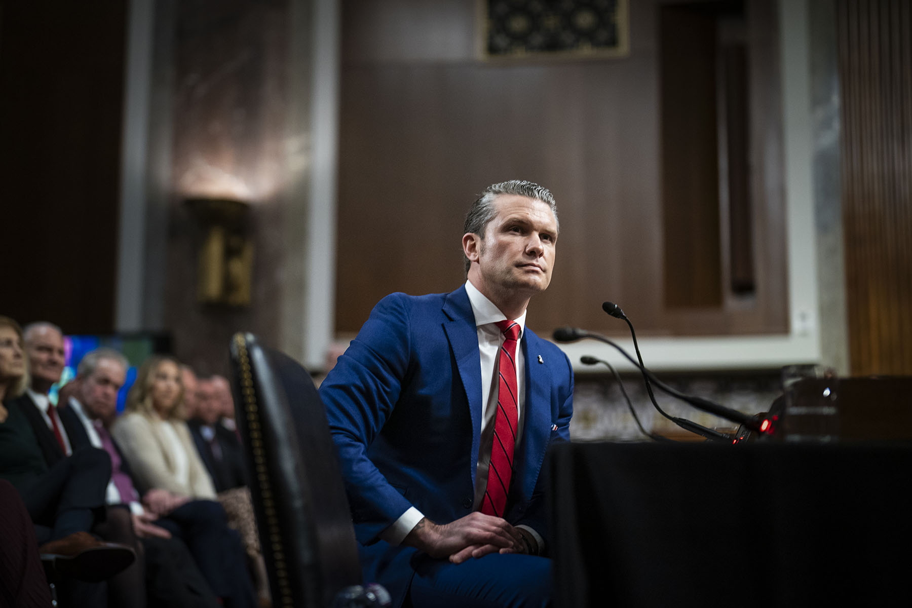 Pete Hegseth listens during a Senate Armed Services Committee confirmation hearing.