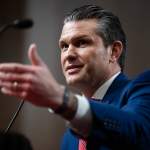 Pete Hegseth gestures during a confirmation hearing