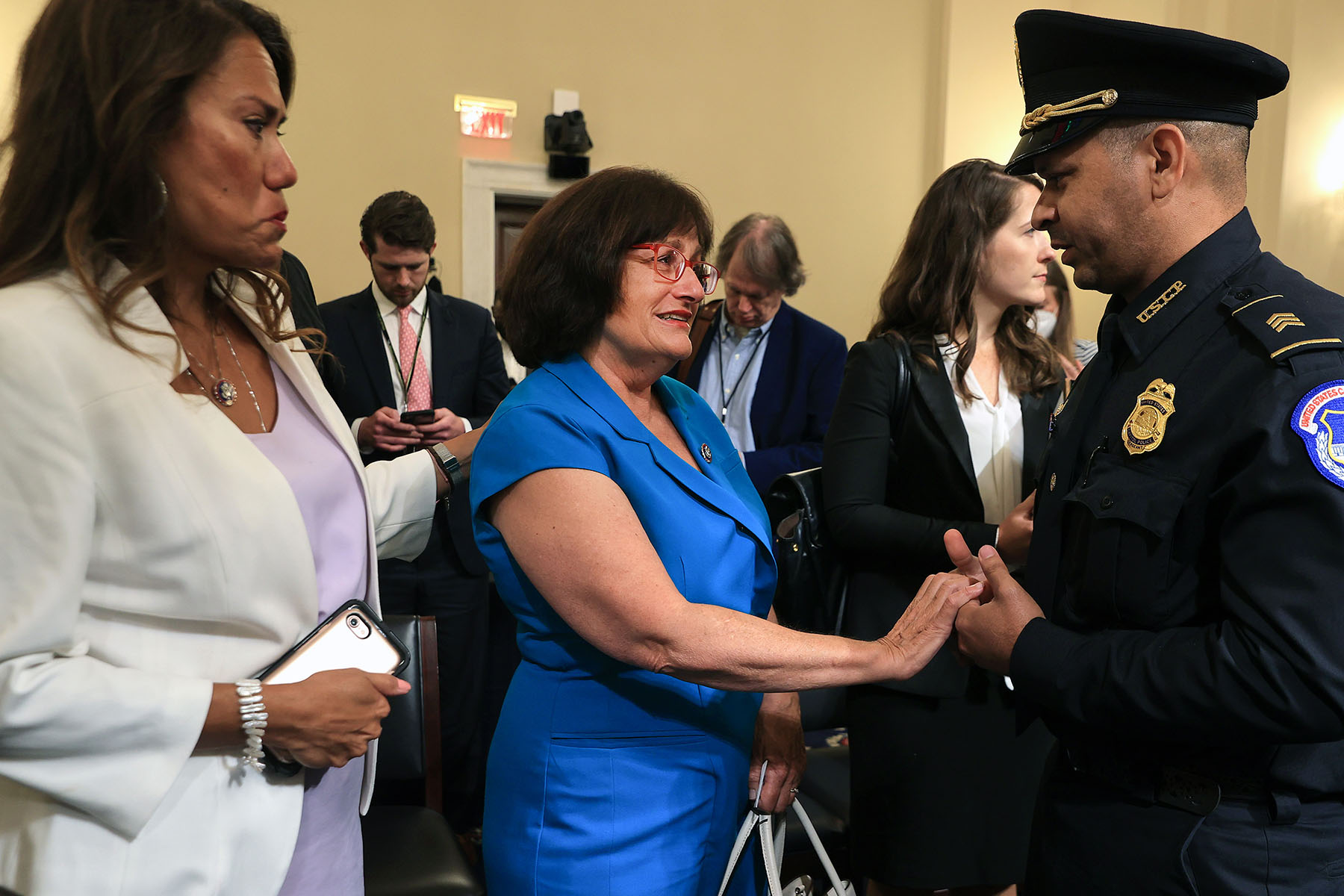 Rep. Ann McLane Kuster talks to Capitol Police officer Sgt. Aquilino Gonell after he testified before the House Select Committee investigating the January 6 attack on the Capitol.