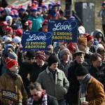 A group of anti-abortion rights activists hold signs and rally on the National Mall in Washington, DC.