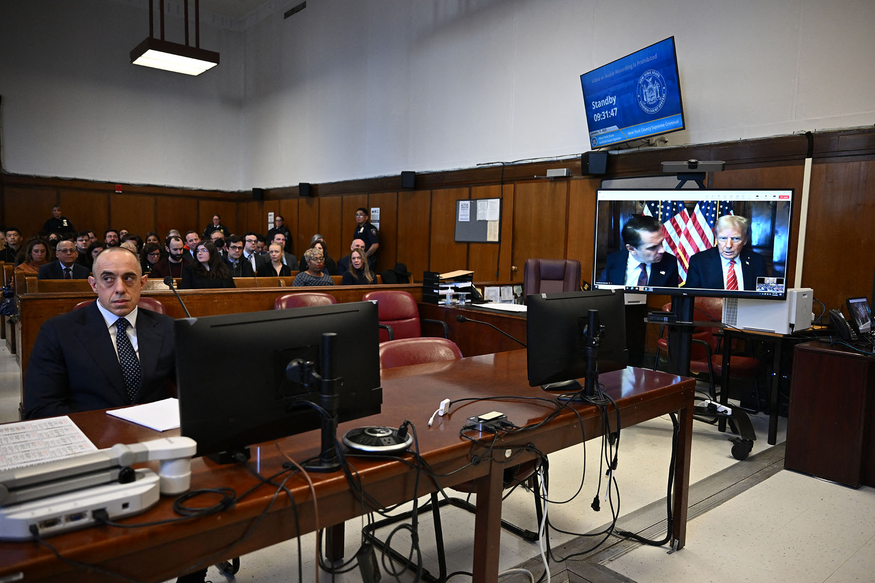 Trump attorney Emil Bove looks on as President-elect Donald Trump appears remotely for a sentencing hearing.