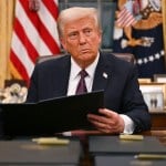 President Donald Trump signs an executive order in the Oval Office of the White House in Washington, D.C.