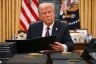 President Donald Trump signs an executive order in the Oval Office of the White House in Washington, D.C.