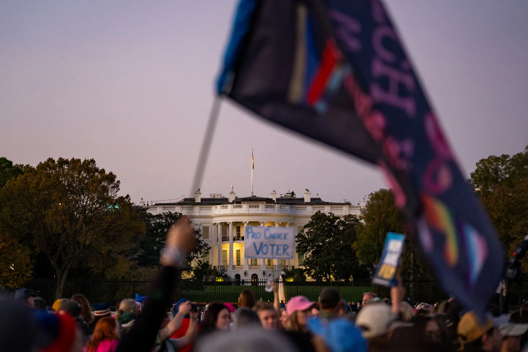 The White House is seen in the distance as people participate in the National Women's March in Washington, D.C.