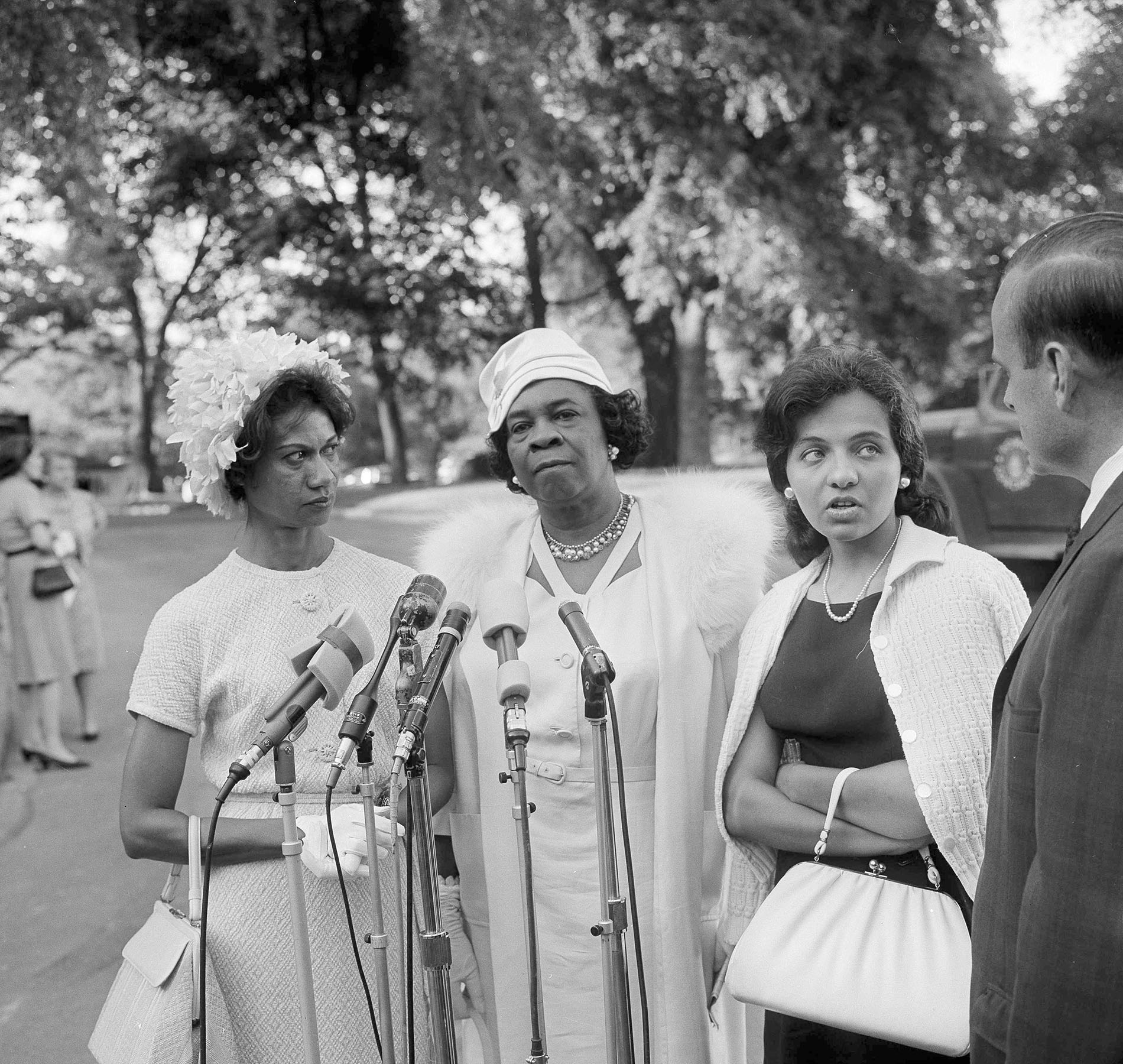 Diane Nash (right) representing the Southern Christian Leadership Committee, is interviewed as she leaves the White House