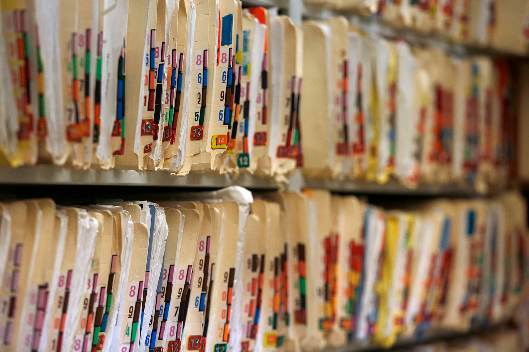 Medical records on shelves in a doctor's office.