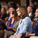 Sarah McBride sits at the swearing-in ceremony for new members of Congress.