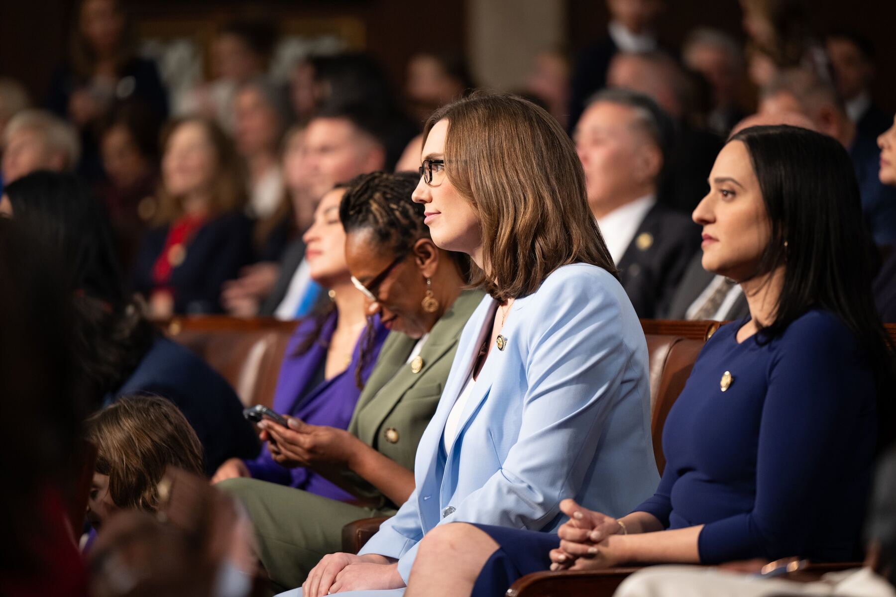 Sarah McBride sits at the swearing-in ceremony for new members of Congress.