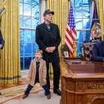 White House staff secretary Will Scharf, Tesla and SpaceX CEO Elon Musk, joined by his son X Musk, and U.S. President Donald Trump appear for an executive order signing in the Oval Office.