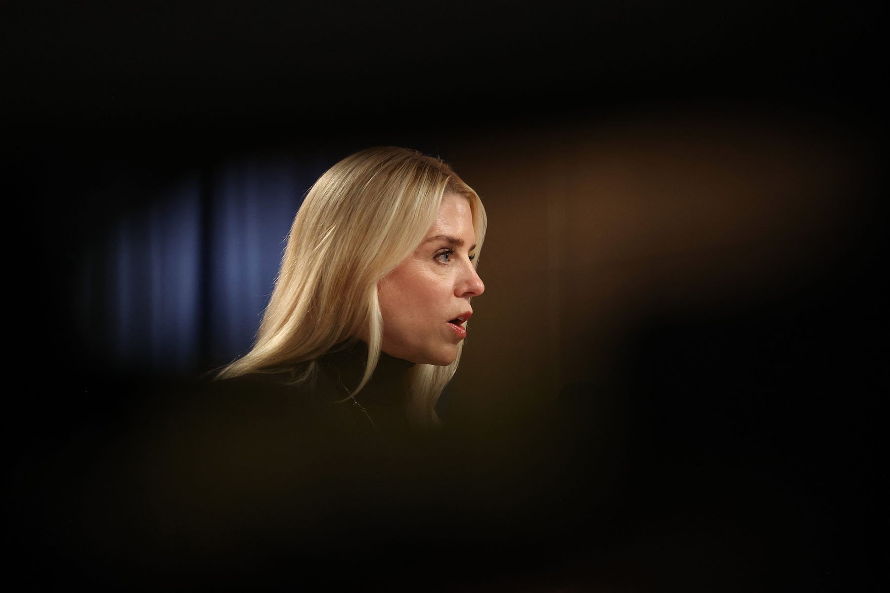 Attorney General Pam Bondi speaks at a press conference to announce a new Justice Department legal action on immigration enforcement at the Justice Department.