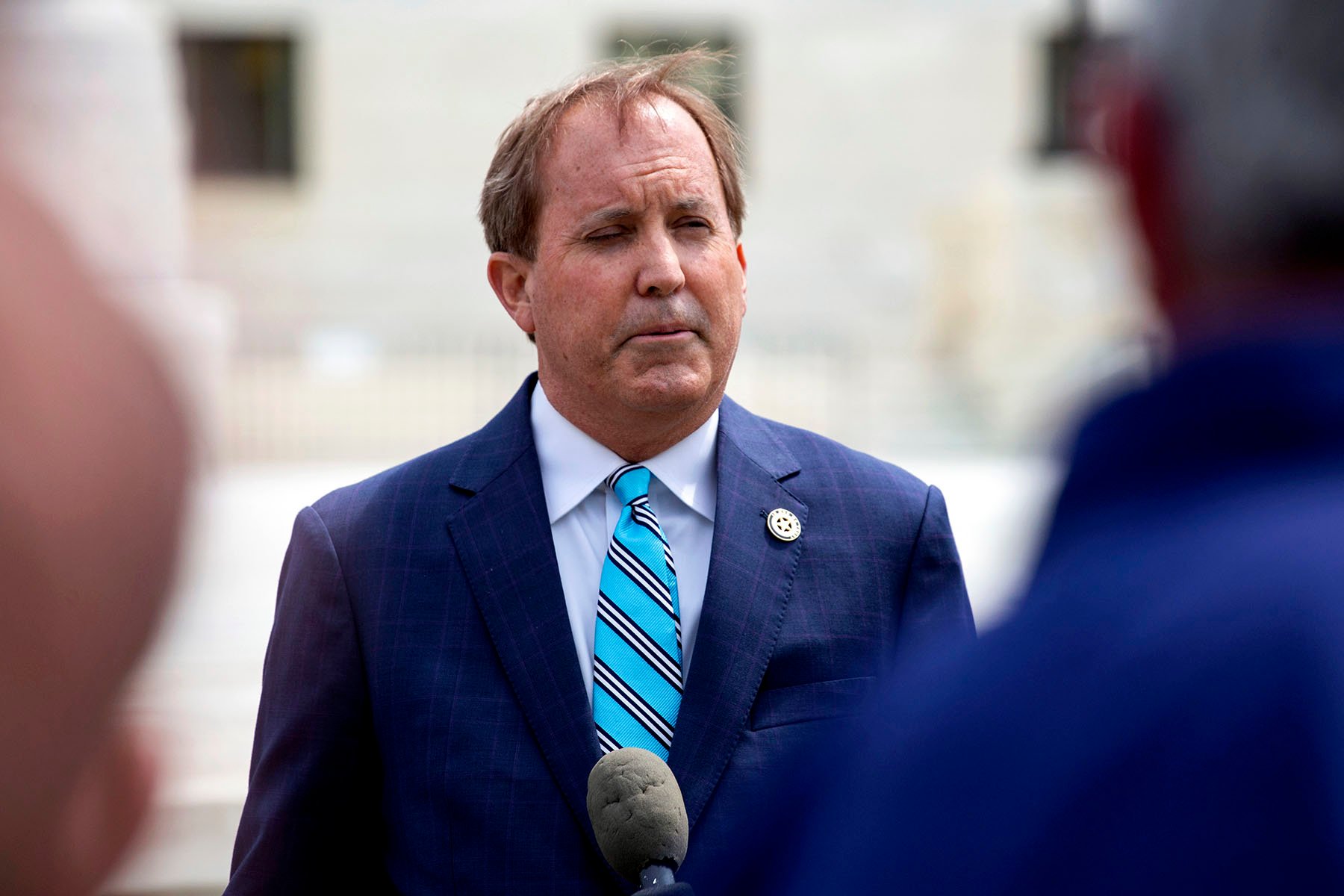 Texas Attorney General Ken Paxton speaks outside of the U.S. Supreme Court.