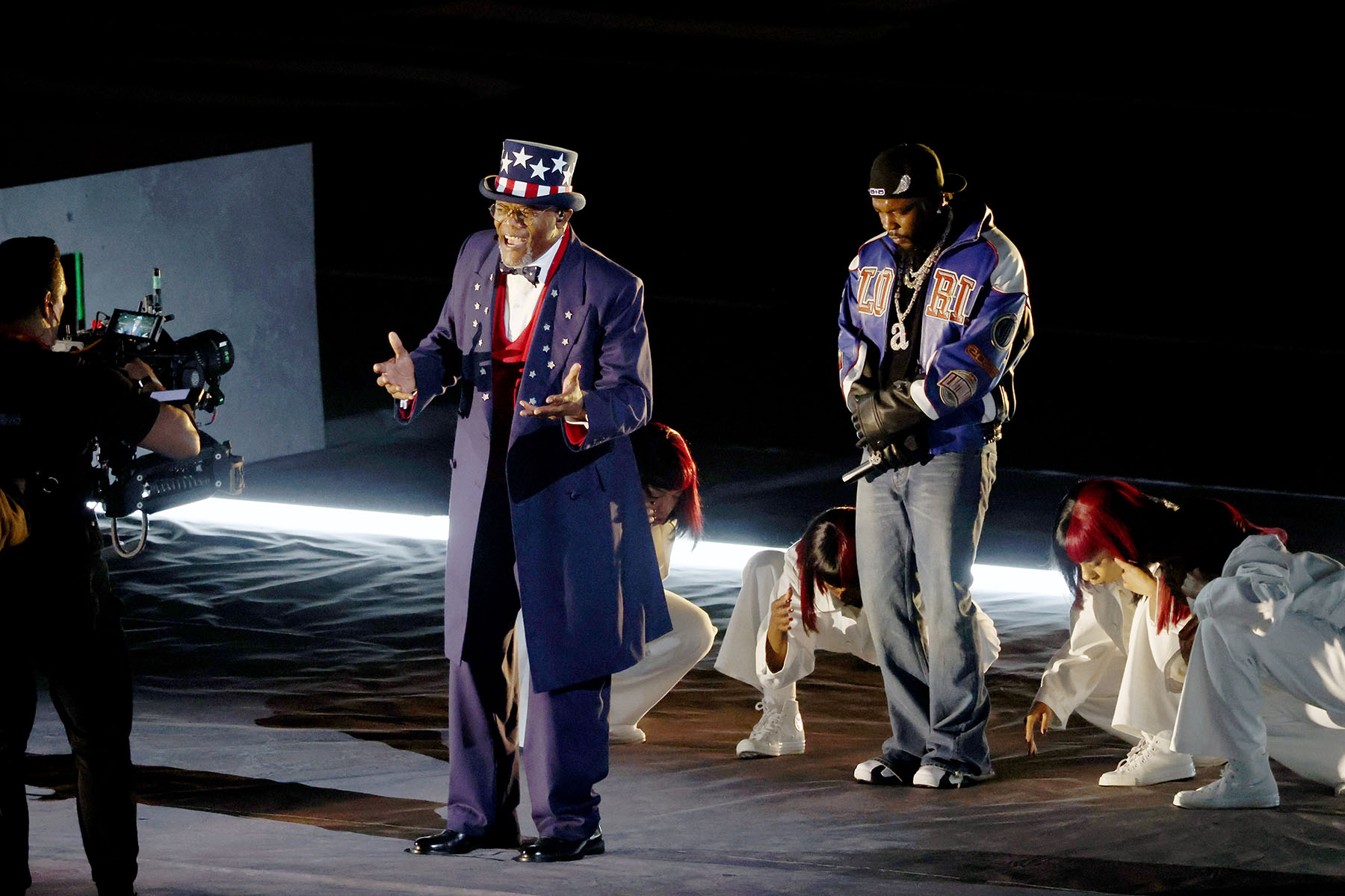 Samuel Jackson, dressed as Uncle Sam, and Kendrick Lamar are seen onstage during the Halftime Show.