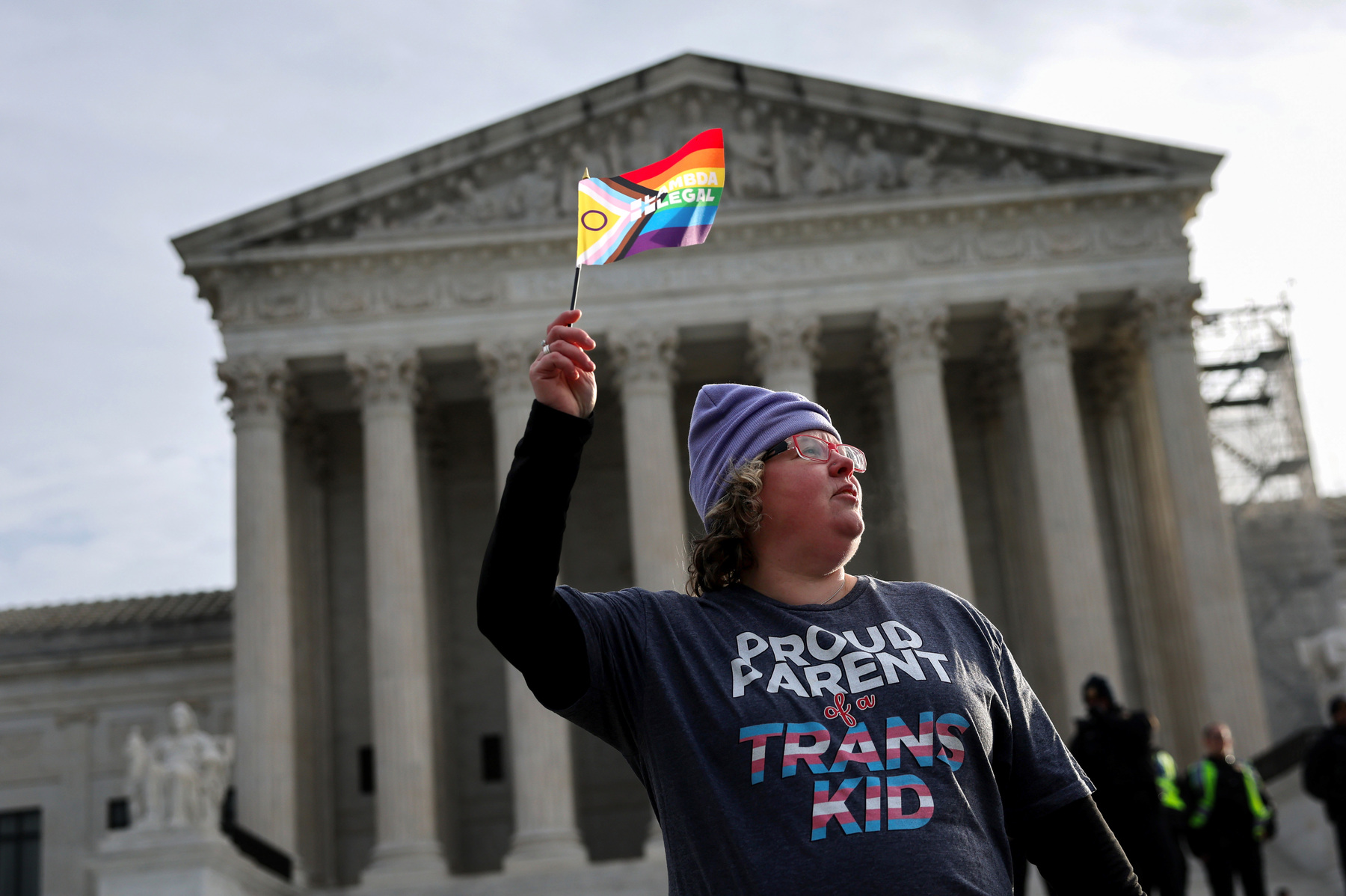 A transgender rights supporter takes part in a rally outside of the U.S. Supreme Court.