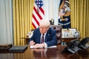 President Trump signs executive orders in the Oval Office at the White House.