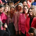 Women Democratic members of Congress wearing pink to protest the Trump administration's policies.