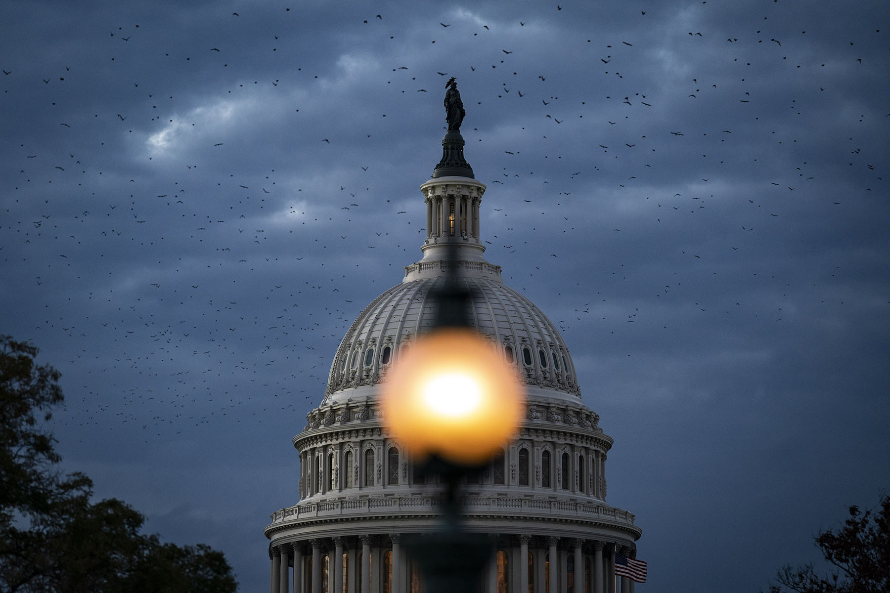 The Capitol Dome is seen as the sun sets on Capitol Hill.