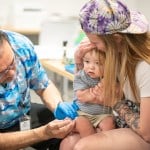 A one-year-old receives the MMR vaccine at the Lubbock Public Health Department in Lubbock, Texas.