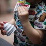 A child holds a dome stress ball during a rally at the Capitol.