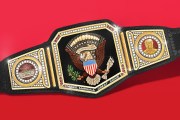 Illustration of A custom wrestling championship belt featuring the Great Seal of the United States in the center, flanked by a presidential portrait of Donald Trump and an image of the White House, with “MAKE AMERICA GREAT AGAIN” engraved at the bottom.
