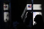 People wait in line to vote at the Oakland Career Center on November 5, 2024.