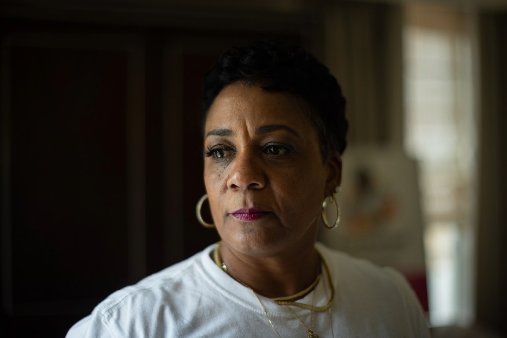 A woman poses for a portrait.