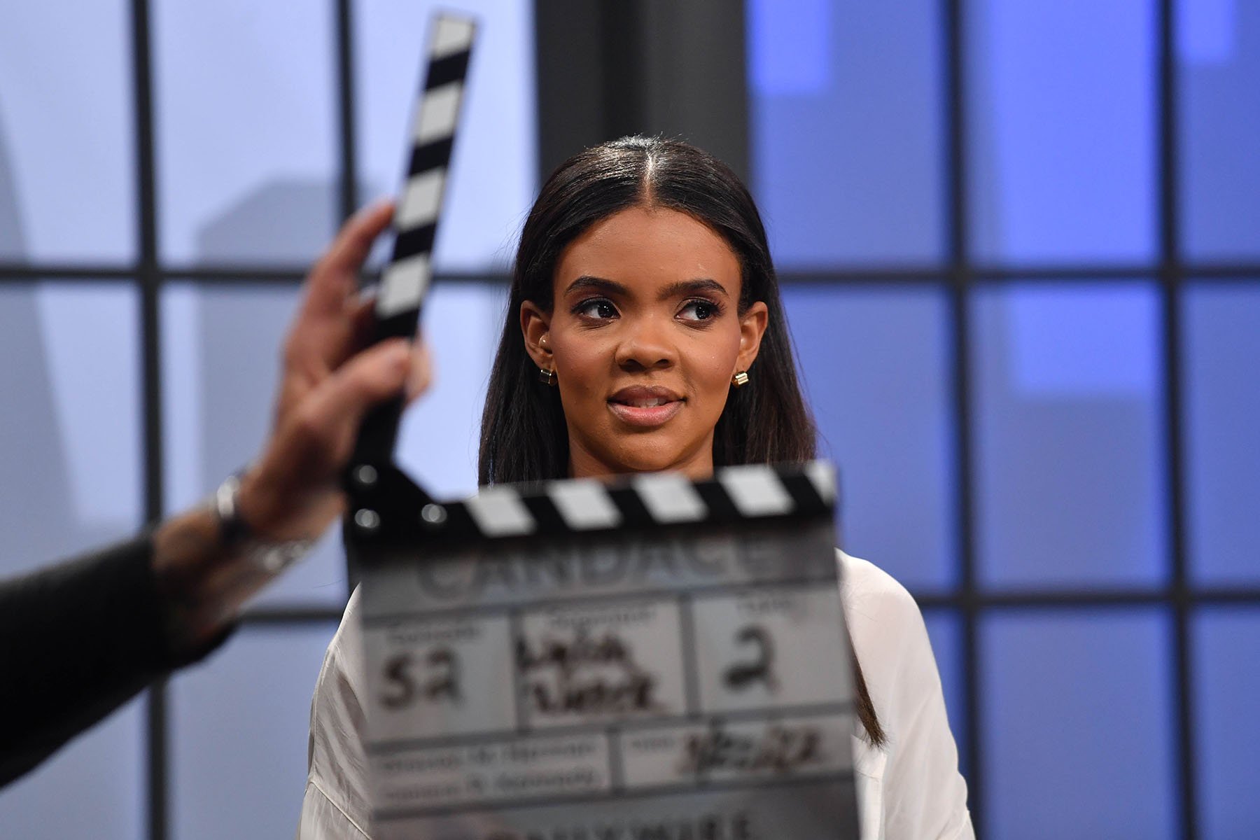 Candace Owens looks past a clapperboard during filming of her show in Nashville.