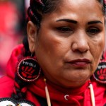 A demonstrator looks on during the annual Missing & Murdered Indigenous Women, People & Families march in Seattle.