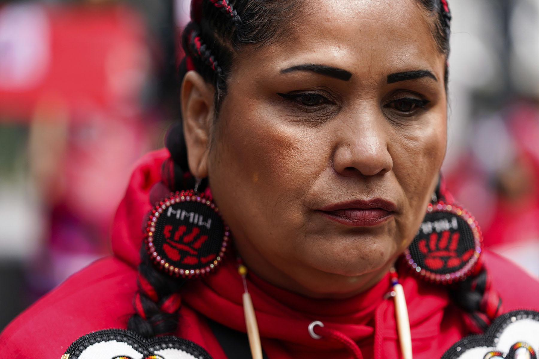 A demonstrator looks on during the annual Missing & Murdered Indigenous Women, People & Families march in Seattle.