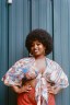A portrait of a woman with an afro.