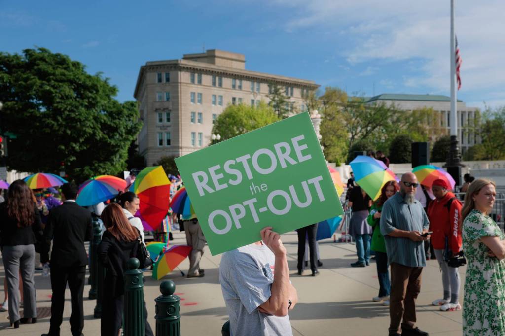 People protesting outside the Supreme Court for a case about schools and religion