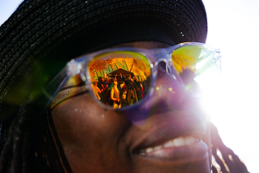 The dance floor is reflected in Terri Flamer's sunglasses.