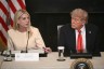 Pam Bondi, the attorney general, sits next to President Donald Trump.