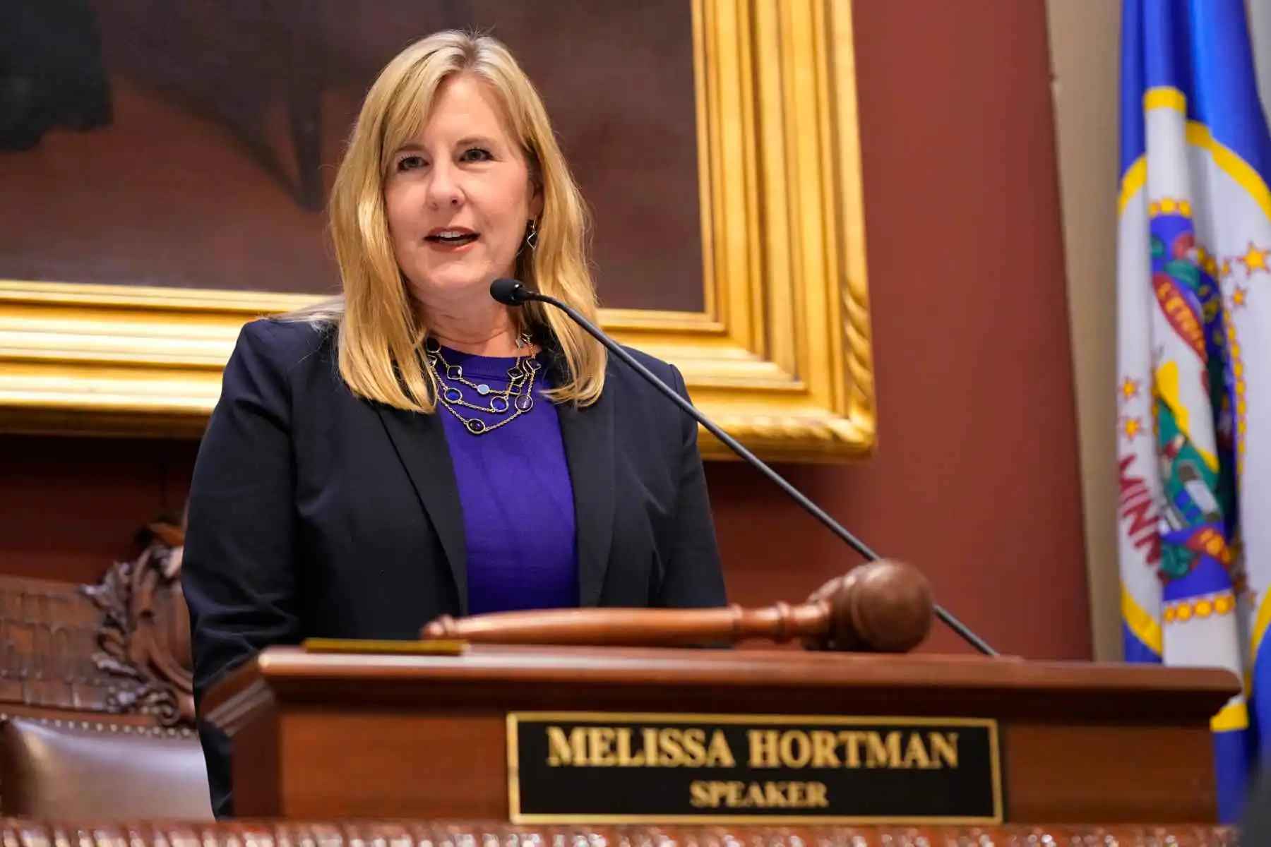 State Rep. Melissa Hortman, wearing a dark blazer and purple shirt, addressing the Minnesota Legislature as speaker in 2023.