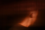 Abstract image of a man with his face turned away from the camera.
