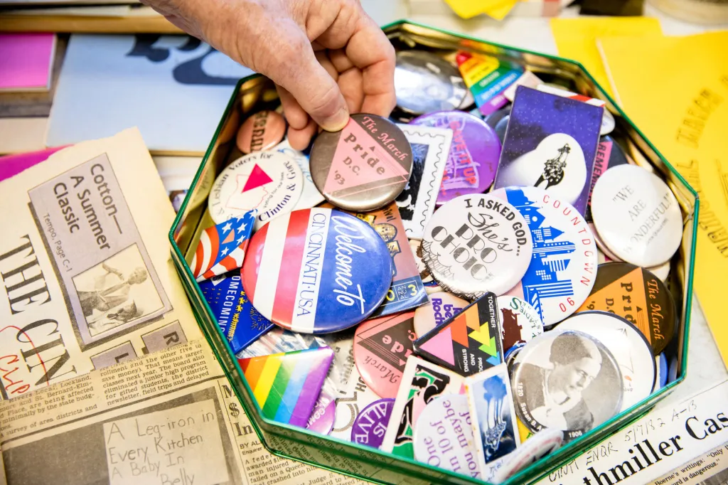 Buttons and other archival materials spread out.