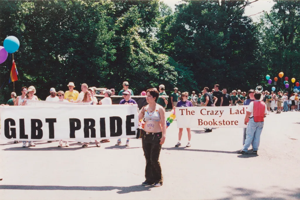 Archival image of people marching down the street for Pride.