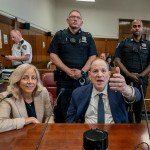 Former film producer Harvey Weinstein gestures as he sits next to attorney Diana Fabi Samson as the jury deliberates at Manhattan Criminal Court