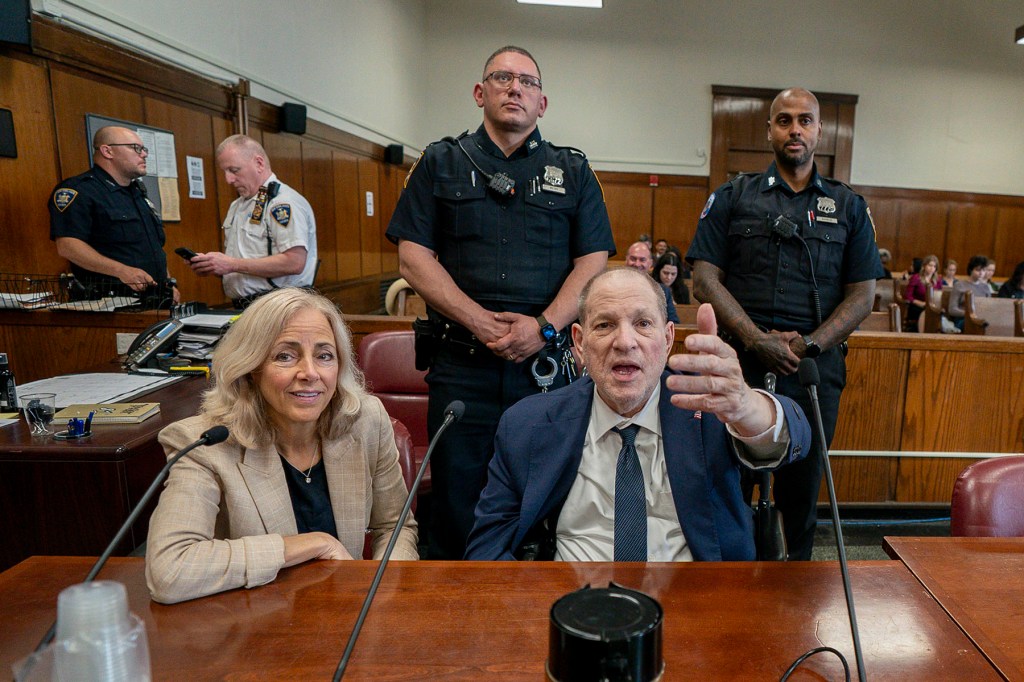 Former film producer Harvey Weinstein gestures as he sits next to attorney Diana Fabi Samson as the jury deliberates at Manhattan Criminal Court