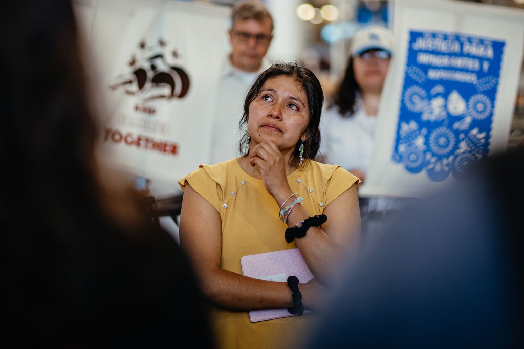 Yessenia Ruano stands amongst friends, family, and immigration supporters during a press conference at Milwaukee Mitchell International Airport before departing for El Salvador on June 17, 2025, in Milwaukee, Wisconsin.