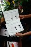 Yessenia Ruano holds up a document as she begins packing in her living room on June 3, 2025, in Milwaukee, Wisconsin.