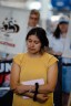 Yessenia Ruano stands amongst friends, family, and immigration supporters during a press conference at Milwaukee Mitchell International Airport.