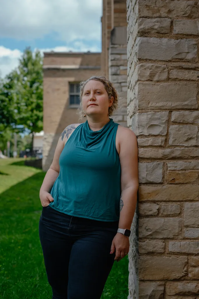 Sarah Weintraub, a special education teacher at ALBA School poses for a portrait outside the school.