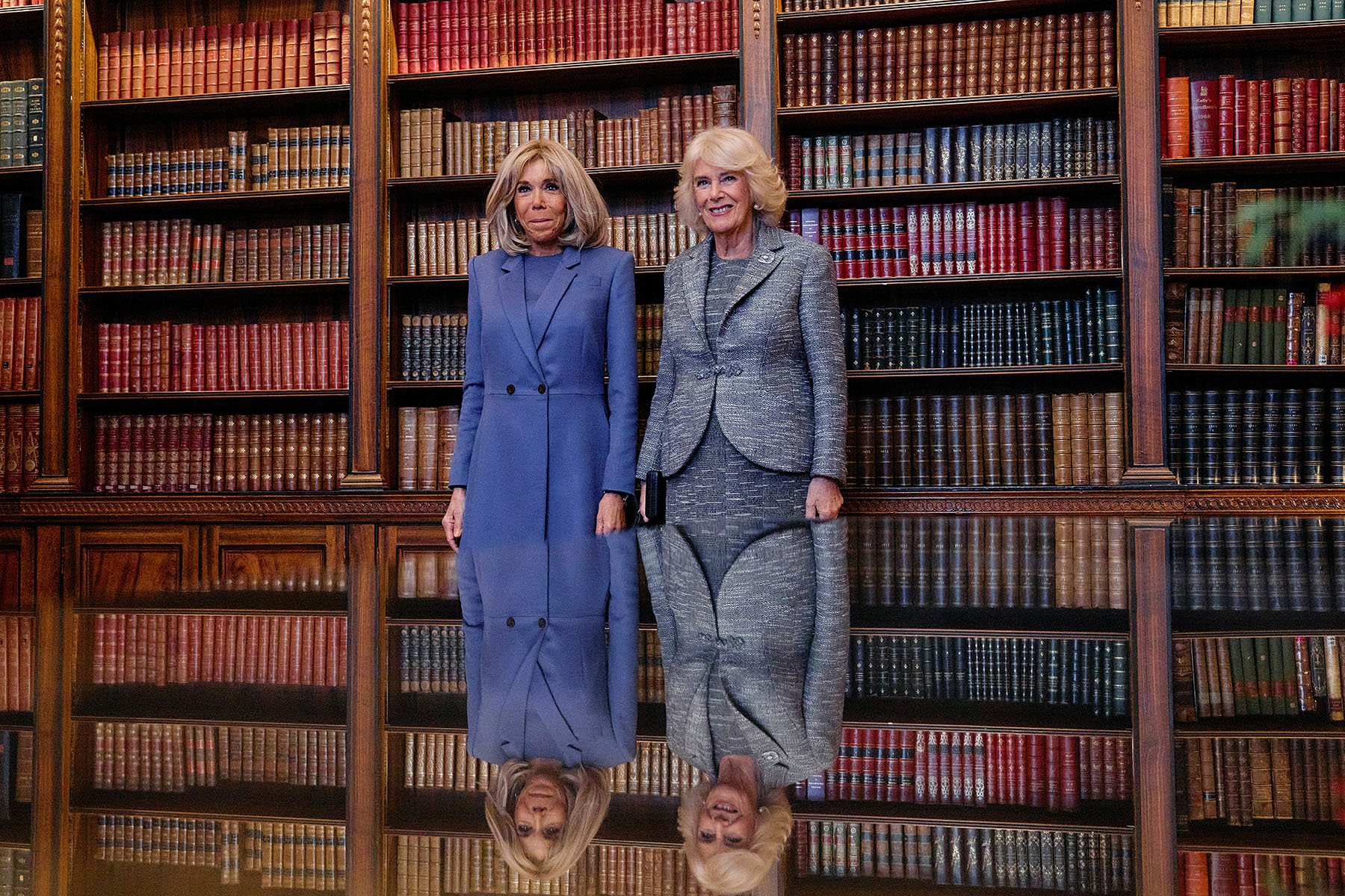 France's first lady Brigitte Macron and Britain's Queen Camilla pose for a picture at the French Ambassador's Residence in London.