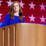 A politician stands at a podium.