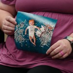An in vitro fertilization patient at the University of Alabama at Birmingham holds up a photo of her daughter, who was conceived via the procedure.