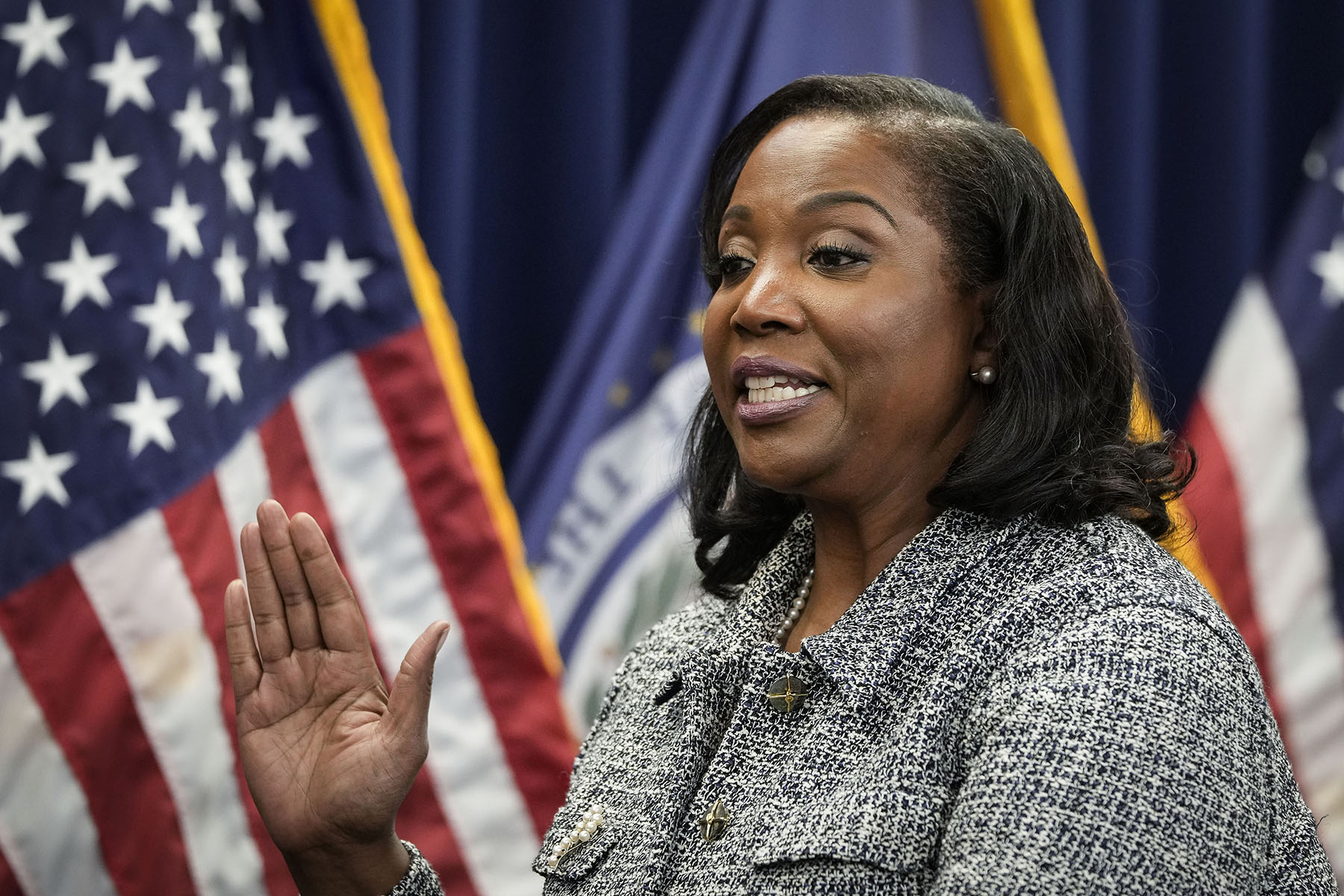 Lisa Cook takes the oath of office to serve as a member of the Board of Governors at the Federal Reserve System.