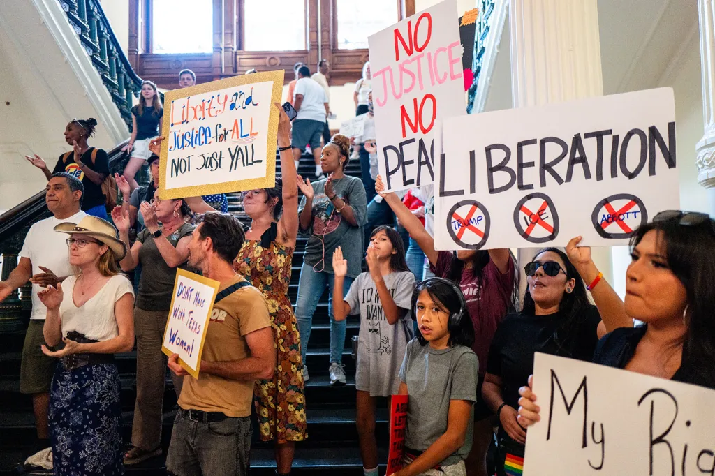 People demonstrate, calling for the release of Democratic Texas Rep. Nicole Collier in the State Capitol.