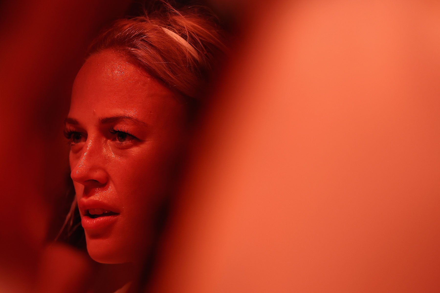 Sophie Cunningham of the Indiana Fever watches from the bench during the first half of the WNBA game.