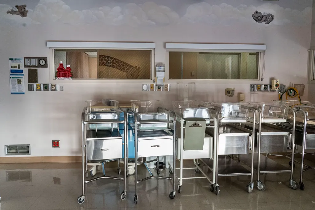 Empty infant beds sit gathered in a corner in a shuttered maternity ward at rural Madera Community Hospital.